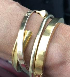 Wearing gold plated Bronze Worry Doll Bangle